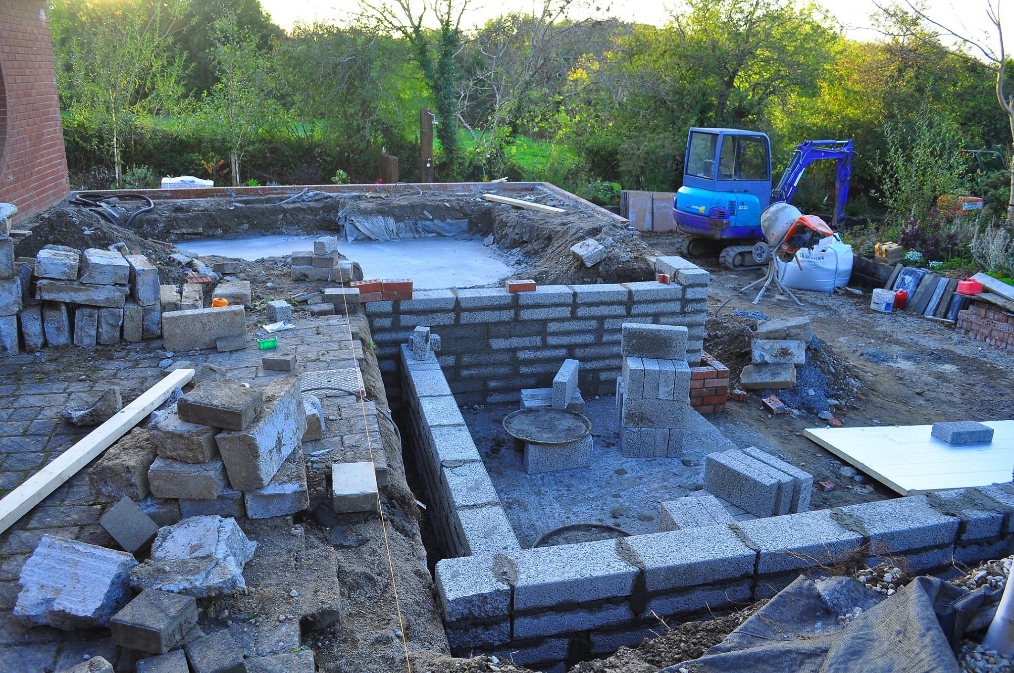A water feature was constructed using a large Limestone slab drilled for water spouts.